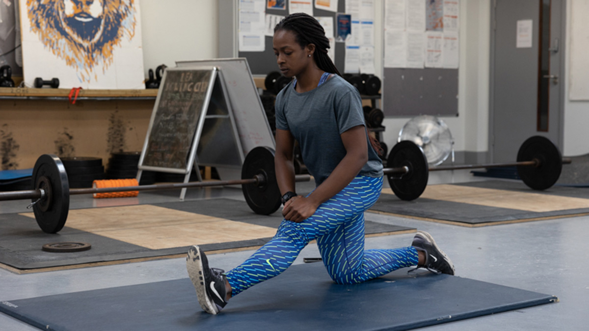 Athlete Stretching Before Velocity Based Strength Training Session