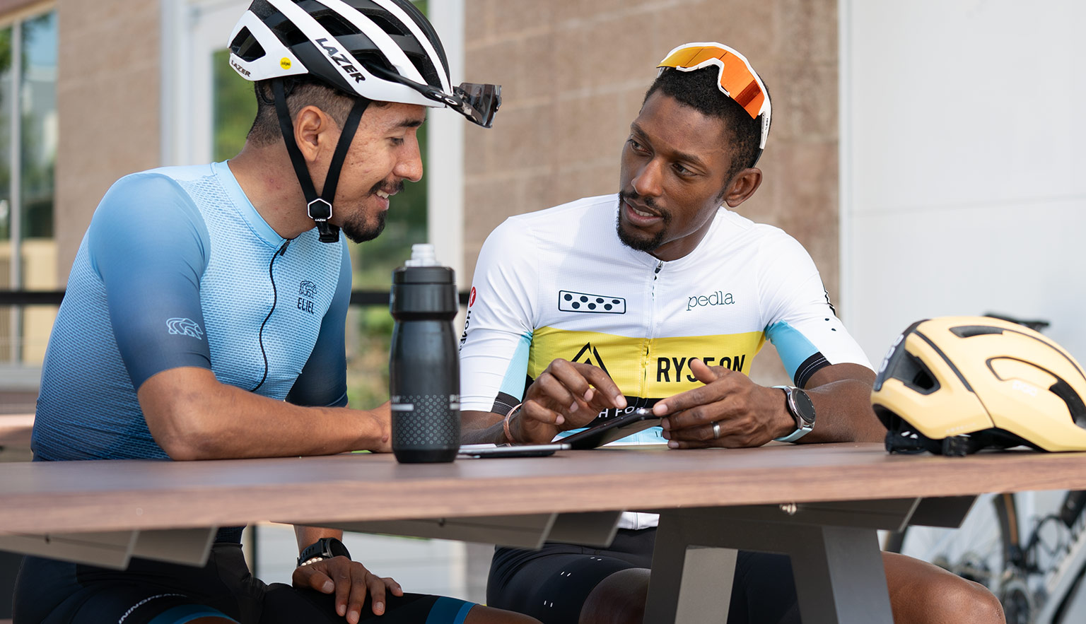 One On One Coaching Tailored To You. Coach Showing Male Cyclist How To Train With Trainingpeaks.