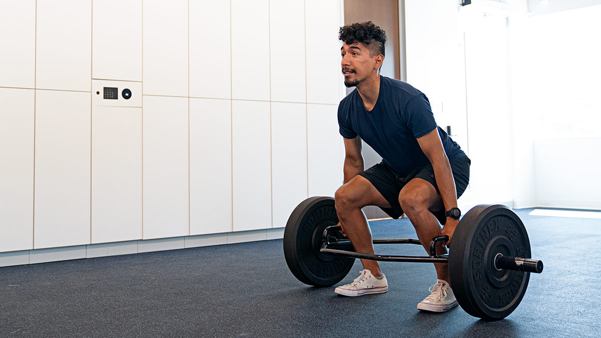 Strength Guide Chapter 7 Male Runner Performing Squat During Strength Training