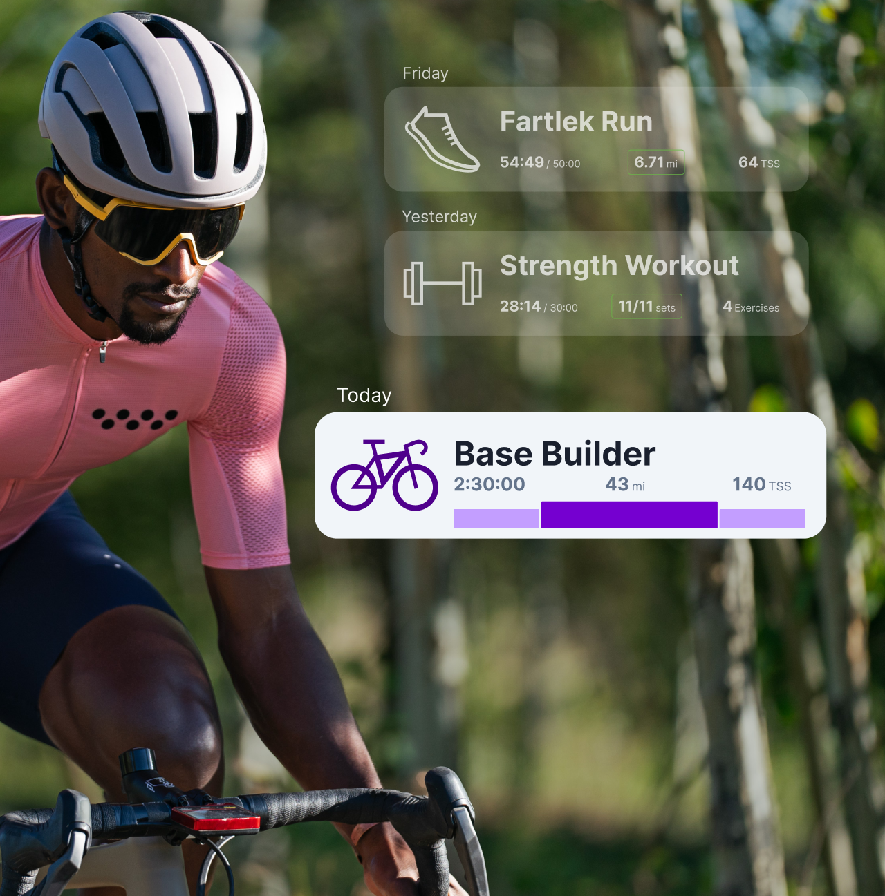 A Male Cyclist Rides Down A Wooded Road. Graphics Of The Trainingpeaks App Are Overlaid Over The Image.